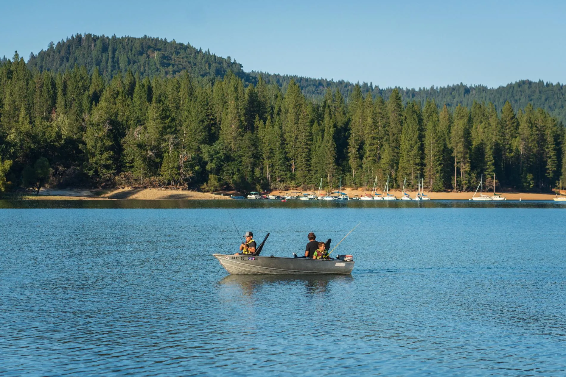 Angler holding a trout caught at a lake near Grass Valley