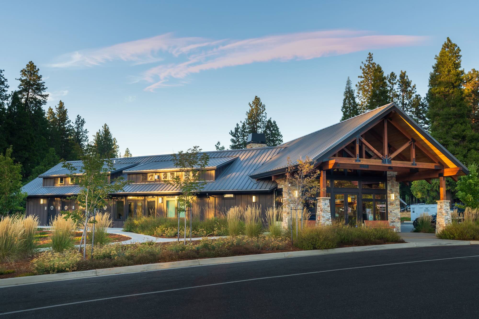 Front entrance and landscaped grounds at Grass Valley RV Resort lodge