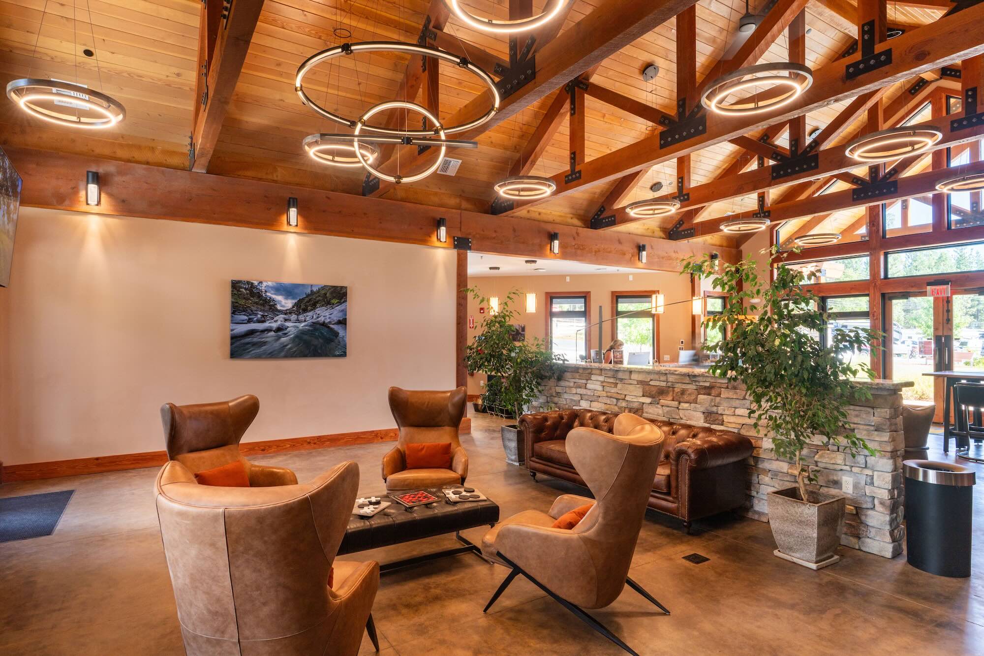 Lodge lounge with fireside seating and timber beams