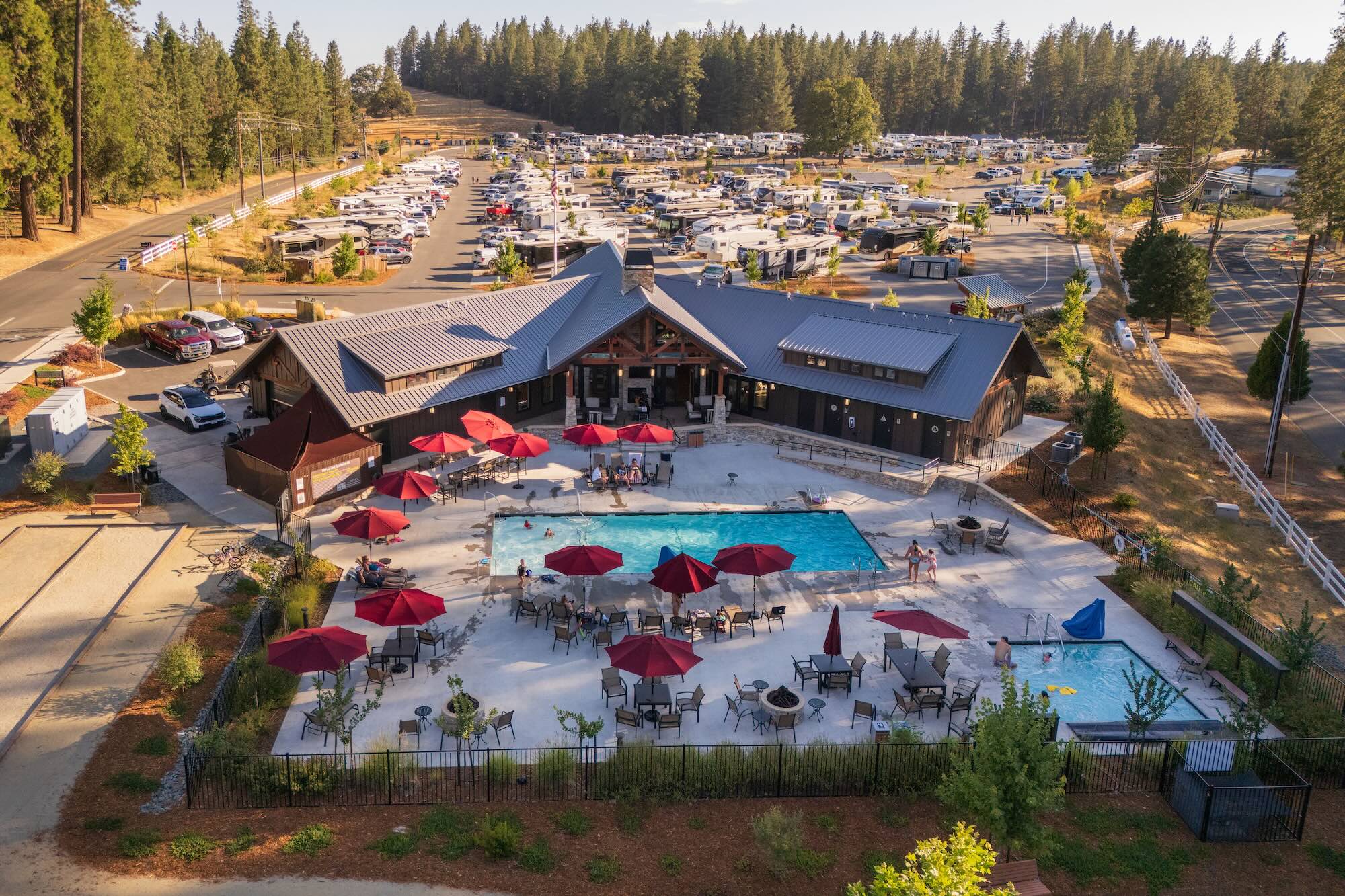 Heated swimming pool with lounge chairs at Grass Valley RV Resort
